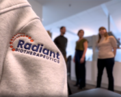 Close up image of the Radiant Biotherapeutics logo embroidered on the arm of a sweater